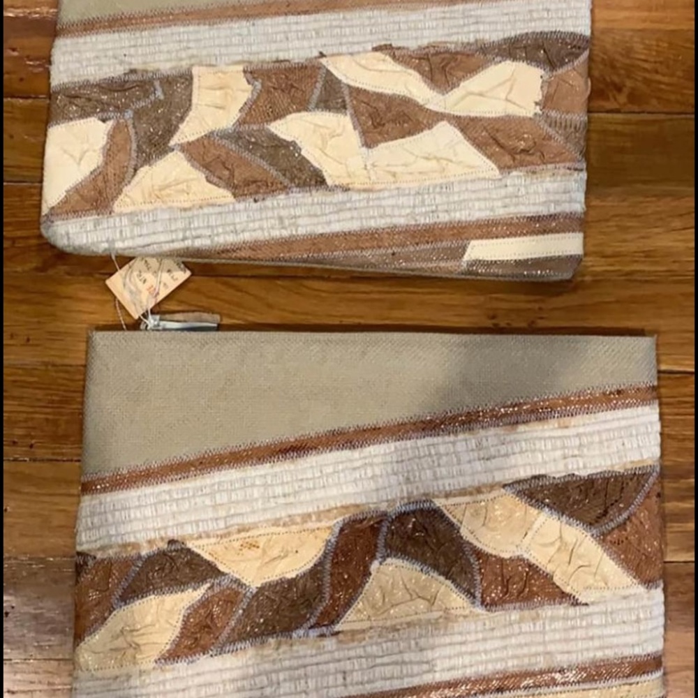 Two tan clutch bags